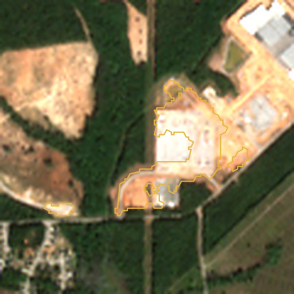 Satellite view in October 2026: 26 acres with a large new pad, outlined in gold
