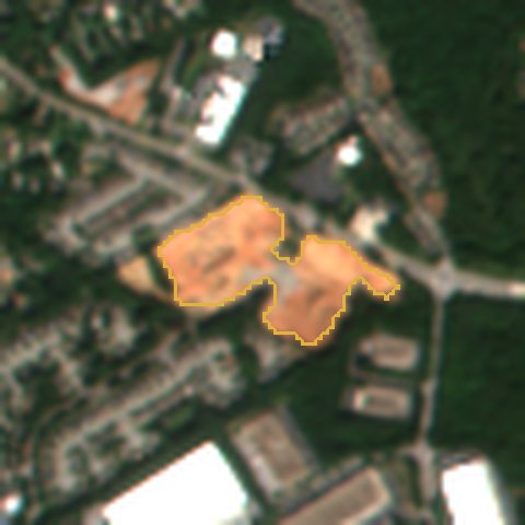 Satellite view in October 2026: 14 acres of bare red clay outlined in gold