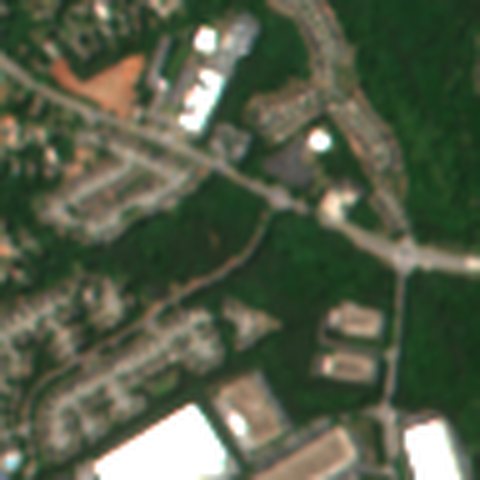Satellite view in May 2026: woods and grass